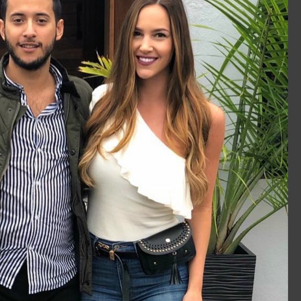 One shoulder, one sleeve white ruffle bodysuit